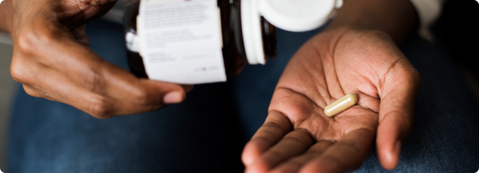 A medical professional wearing medical gloves preparing a shot