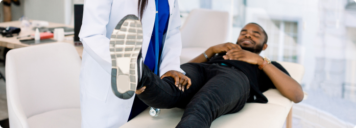 A doctor carefully listening to a patient