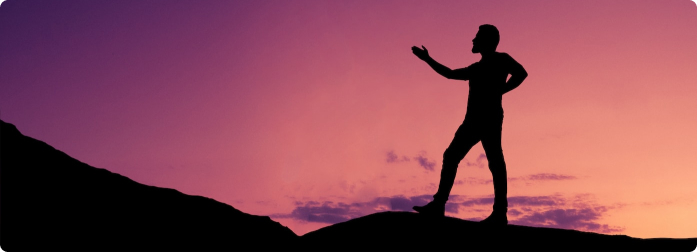 a man doing tai chi on a mat in a field